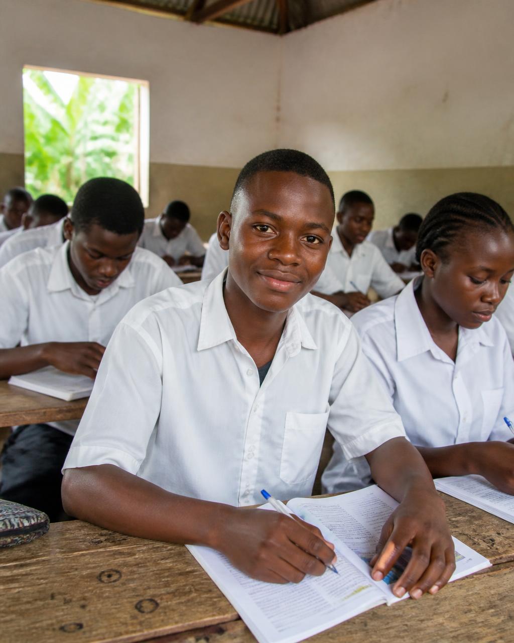 Secondary school students studying in a rural classroom in Cameroon